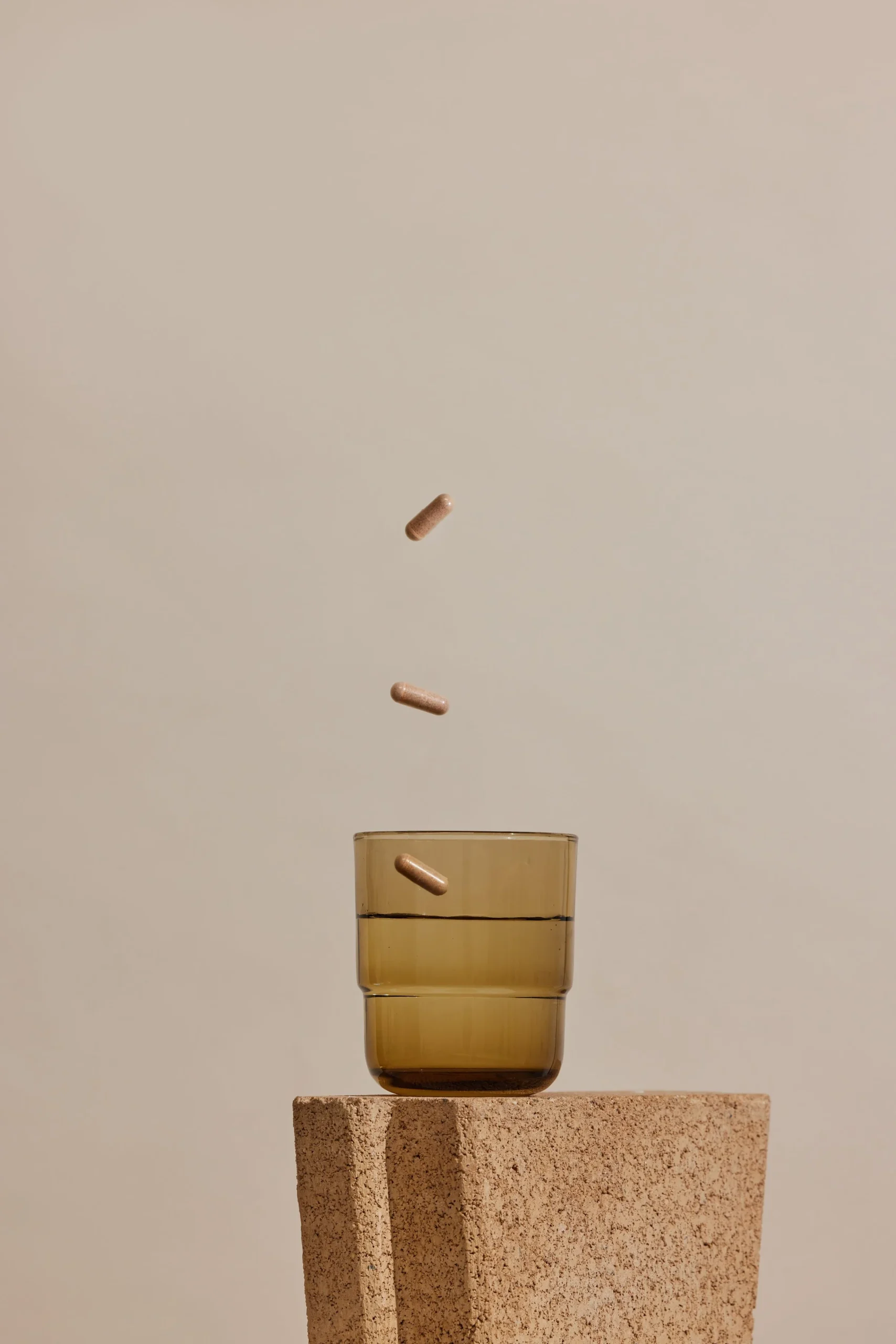 Vitamins In Glass With Neutral Tones