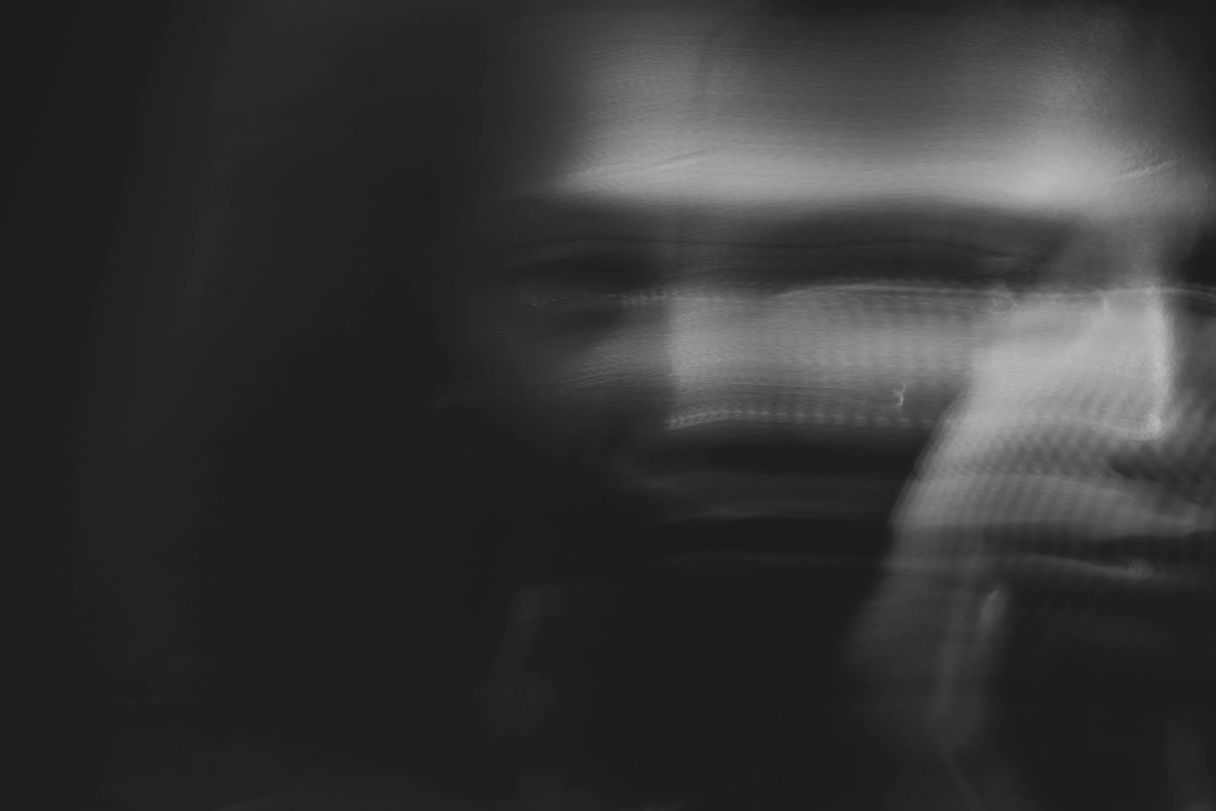 Black and white distorted image of a man