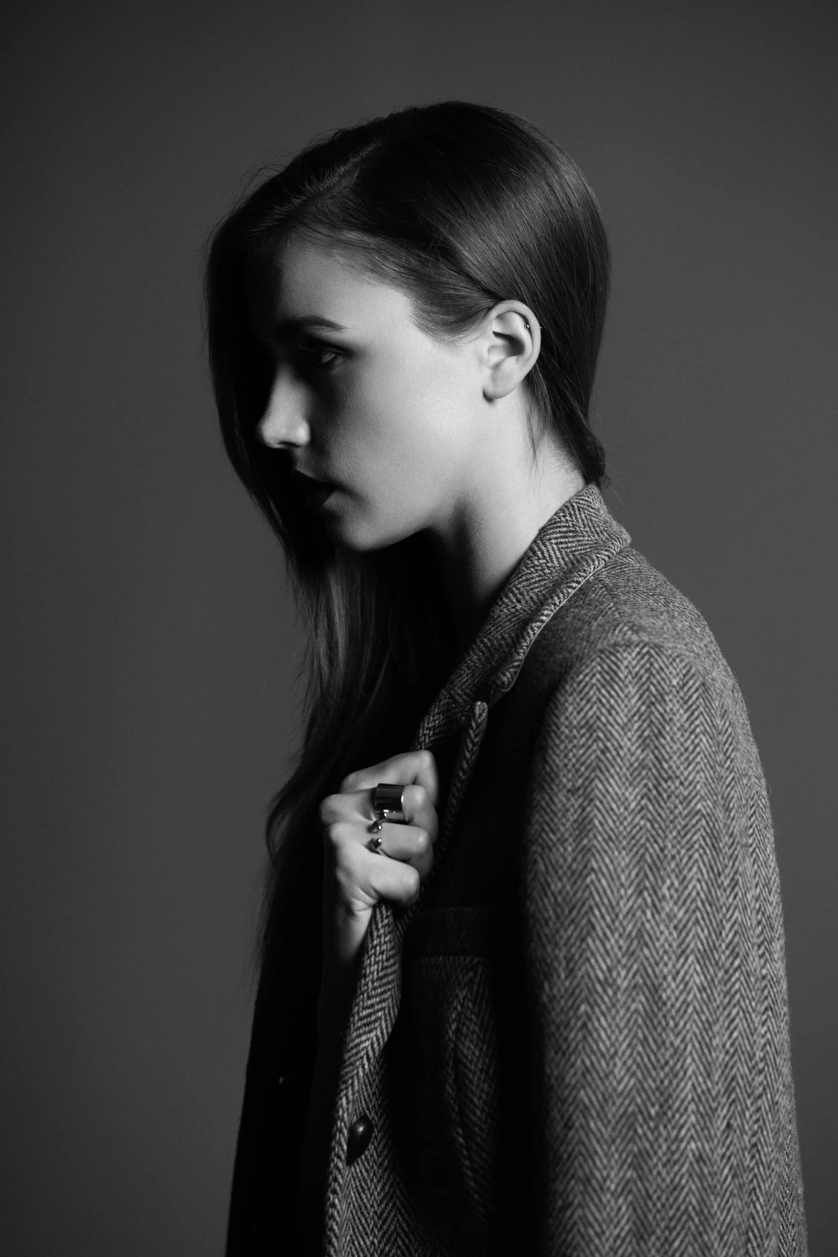Black and white side profile portrait of a woman